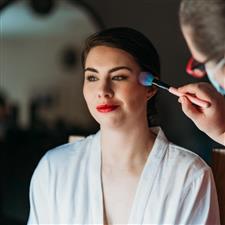 Red haired lipstick gets blusher applied