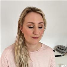 Rose gold eyshadow and soft muted pink lipstick on blonde woman