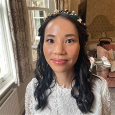 Fresh dewy makeup on Asian bride with dark hair